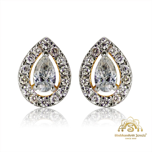 Teardrop diamond halo earrings in white gold