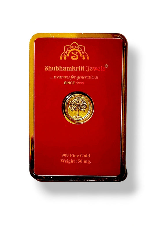 A Shubhamkriti Jewels 999 Fine Gold tree coin presented in a red display card with gold trim, on a white background.